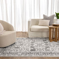 Sierra Grey Oriental Border Rug styled with furniture