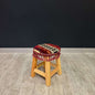 Traditional Stool Maroon-Upgrade your home with the Antep Authentic Chair, a traditional Turkish wooden stool featuring a 100% cotton cushion, firm sponge filling, and intricate ethnic patterns with tassel details. Made from durable Sedir wood in Türkiye,