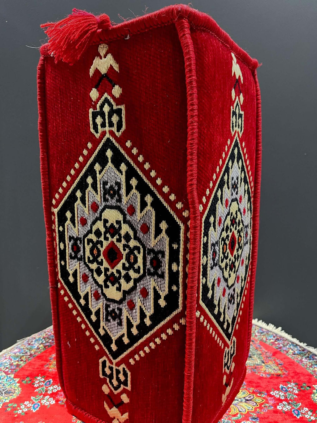 Traditional Turkish Armrest Cushion with colorful patterns and textures in red and black.