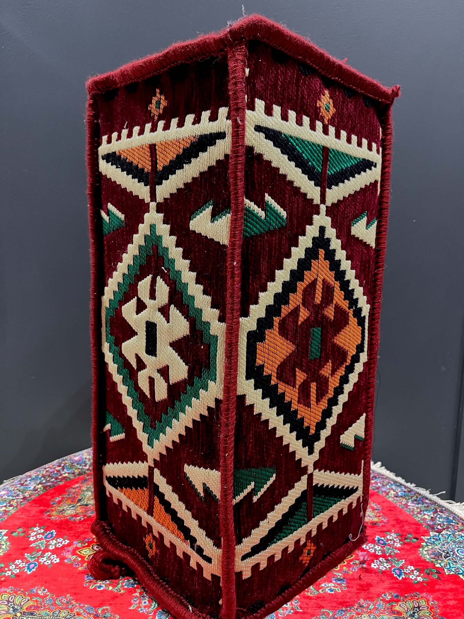 Traditional Turkish Armrest with vibrant patterns in maroon, providing colorful floor seating support.