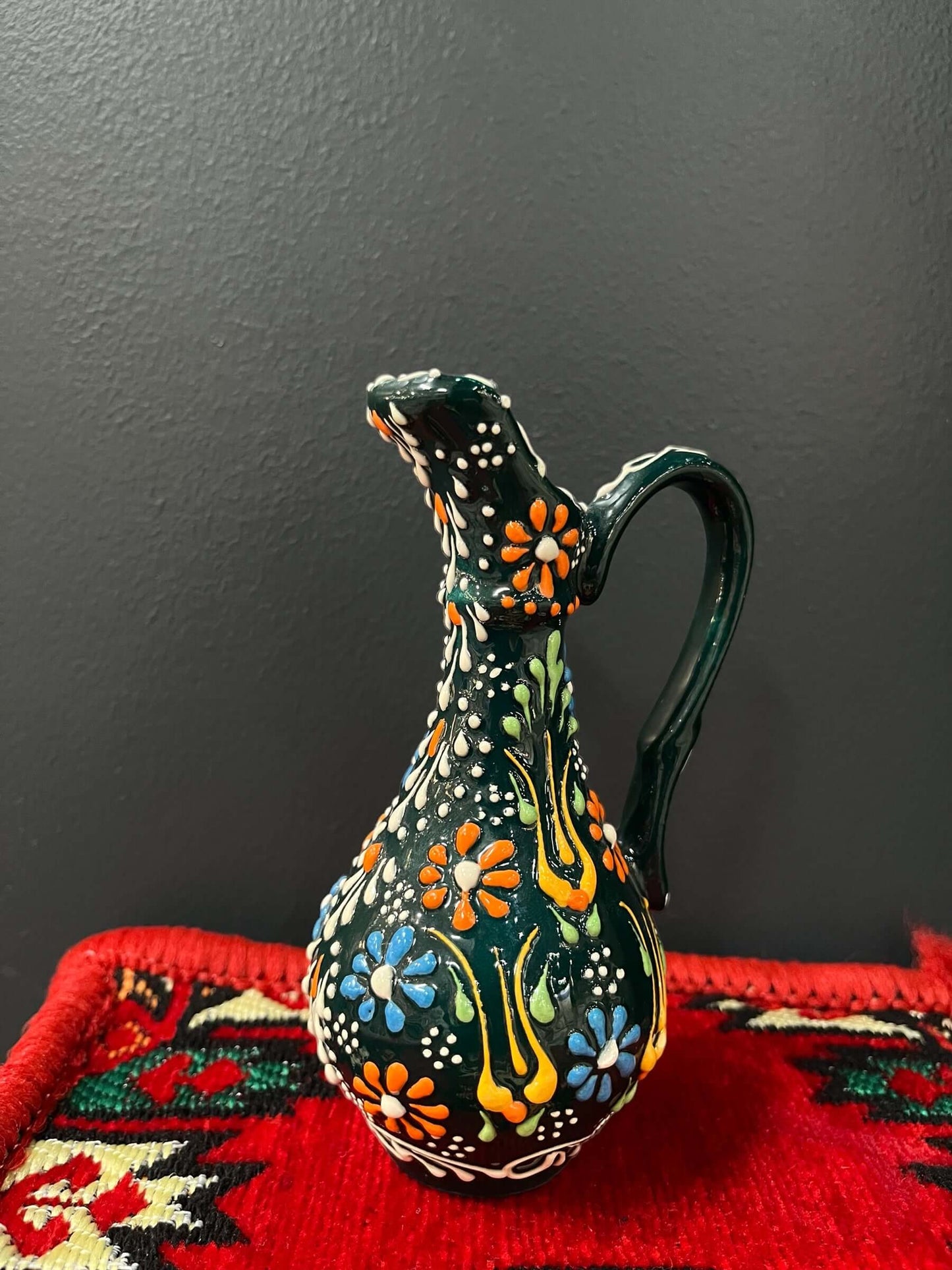 Turkish Ceramic Oil Jug Dark Green-Turkish Ceramic Oil Jug adorned with captivating tulip designs, meticulously handcrafted in Turkey. This elegant piece seamlessly blends art and functionality with its unique design and high-quality materials. Elevate yo