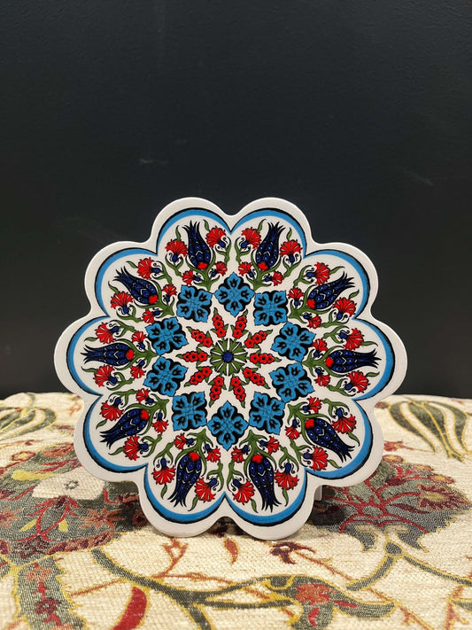 Turkish Ceramic Trivet Blue-White-Red-Discover our Turkish Ceramic Trivet, a perfect blend of artistry and functionality. Crafted in Turkey, this 18cm heat-resistant trivet protects surfaces and features a vibrant mosaic design inspired by Turkish art. Ea