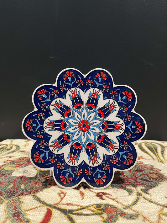 Turkish Ceramic Trivet Navy-Discover our Turkish Ceramic Trivet, a perfect blend of artistry and functionality. Crafted in Turkey, this 18cm heat-resistant trivet protects surfaces and features a vibrant mosaic design inspired by Turkish art. Easy to clea