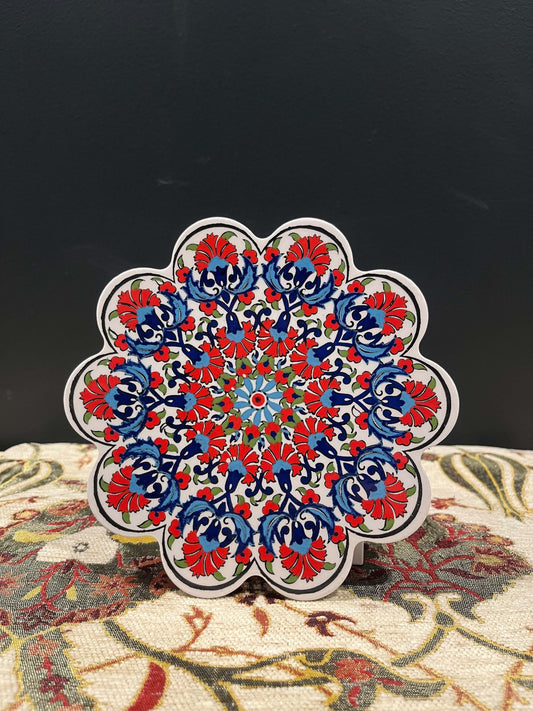 Turkish Ceramic Trivet Red-Discover our Turkish Ceramic Trivet, a perfect blend of artistry and functionality. Crafted in Turkey, this 18cm heat-resistant trivet protects surfaces and features a vibrant mosaic design inspired by Turkish art. Easy to clean