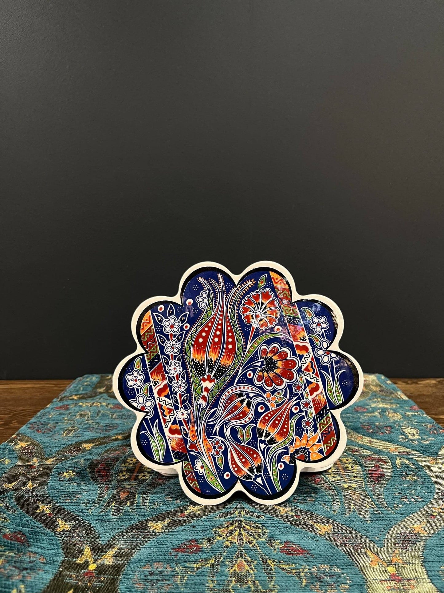 Turkish Ceramic Trivet Red-Blue Tulip-Discover our Turkish Ceramic Trivet, a perfect blend of artistry and functionality. Crafted in Turkey, this 18cm heat-resistant trivet protects surfaces and features a vibrant mosaic design inspired by Turkish art. Ea