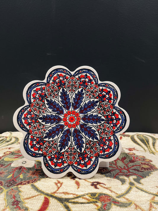 Turkish Ceramic Trivet Red-Navy-Discover our Turkish Ceramic Trivet, a perfect blend of artistry and functionality. Crafted in Turkey, this 18cm heat-resistant trivet protects surfaces and features a vibrant mosaic design inspired by Turkish art. Easy to