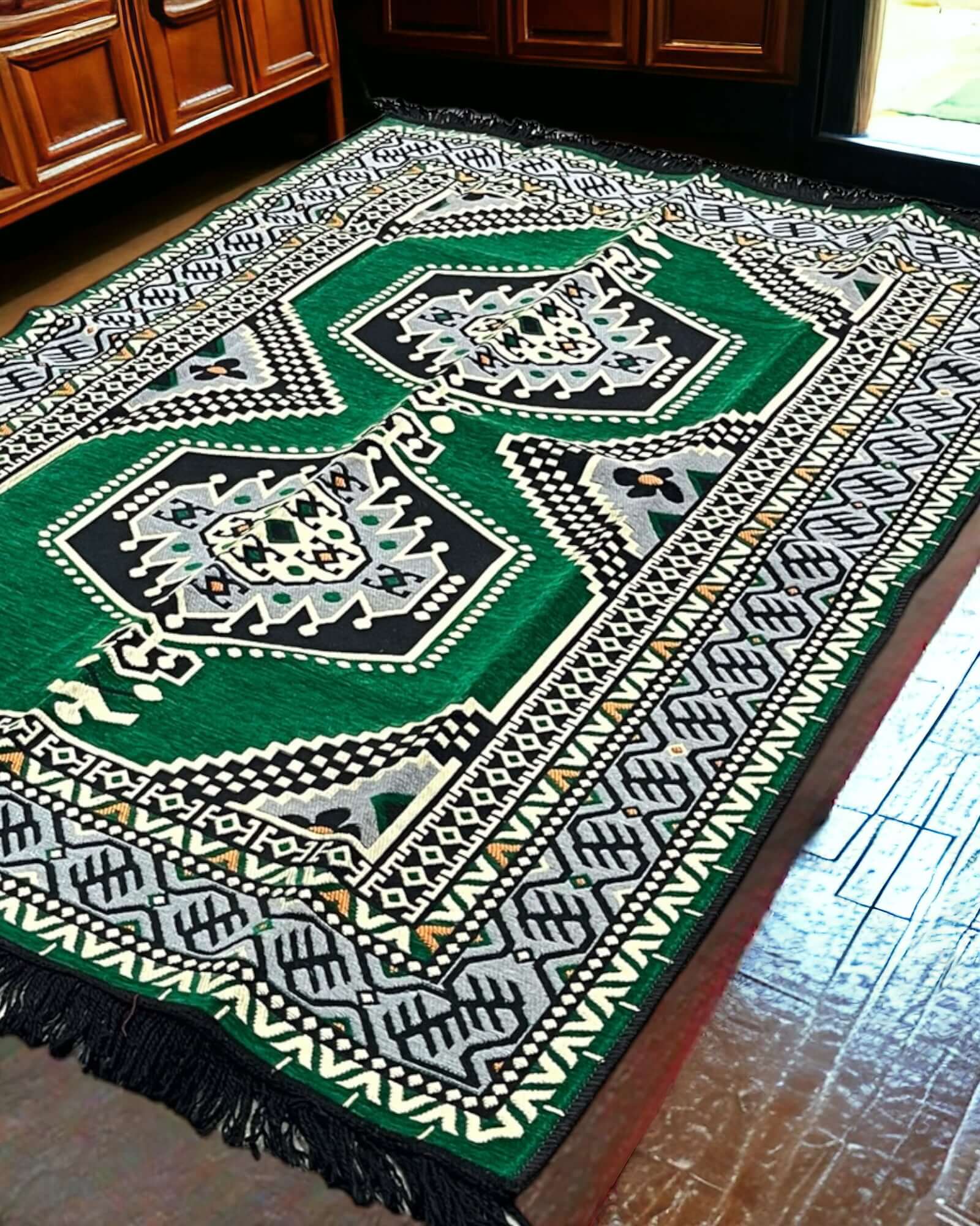 Turkish Kilim Rug (Majlis Green)-the perfect match for your divan set and floor cushions. Crafted from 100% cotton in Turkey, this rug seamlessly complements your living space with its captivating geometric pattern and practical design. Not only does the