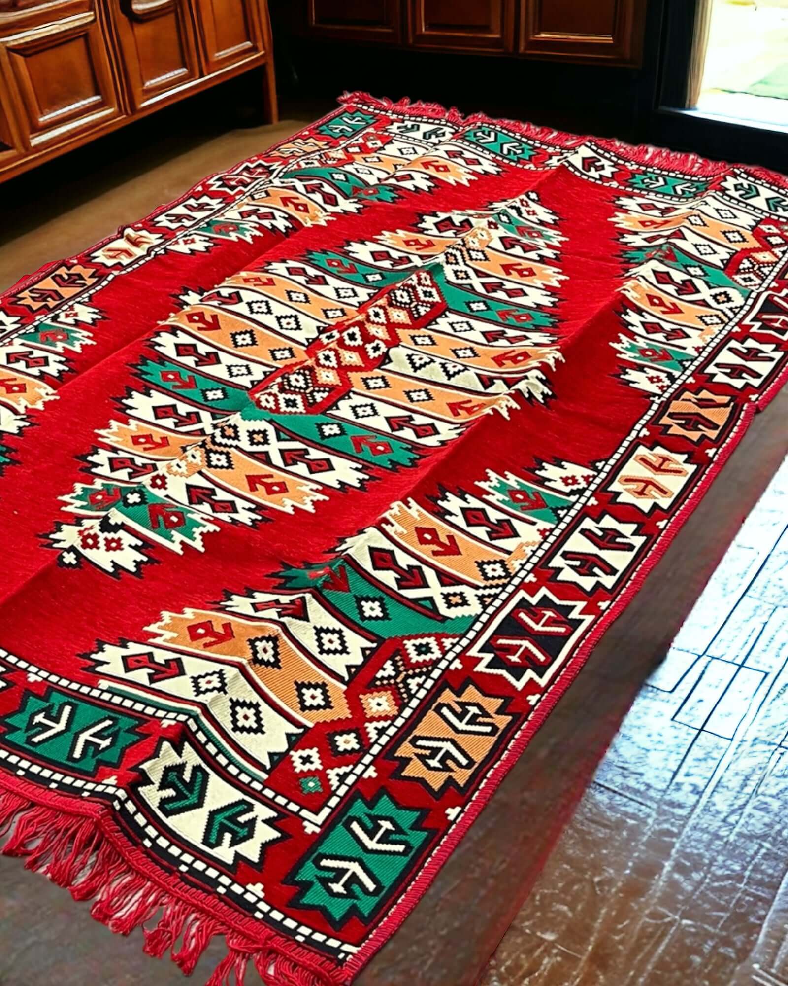 Turkish Kilim Rug (Red Green Pattern)-the perfect match for your divan set and floor cushions. Crafted from 100% cotton in Turkey, this rug seamlessly complements your living space with its captivating geometric pattern and practical design. Not only does