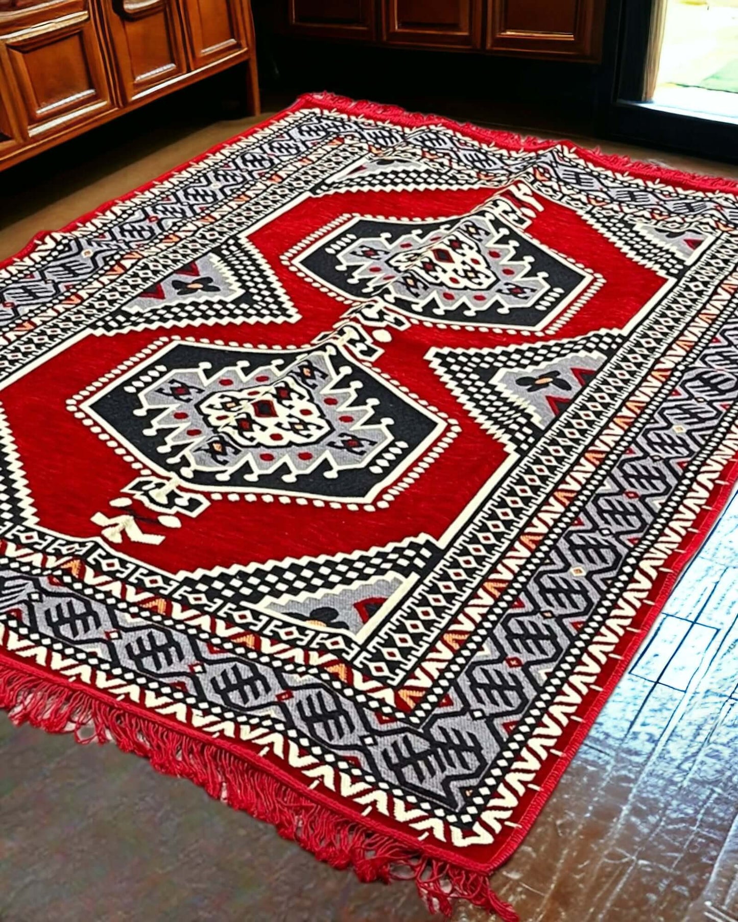 Turkish Kilim Rug (Red Palace)-the perfect match for your divan set and floor cushions. Crafted from 100% cotton in Turkey, this rug seamlessly complements your living space with its captivating geometric pattern and practical design. Not only does the An