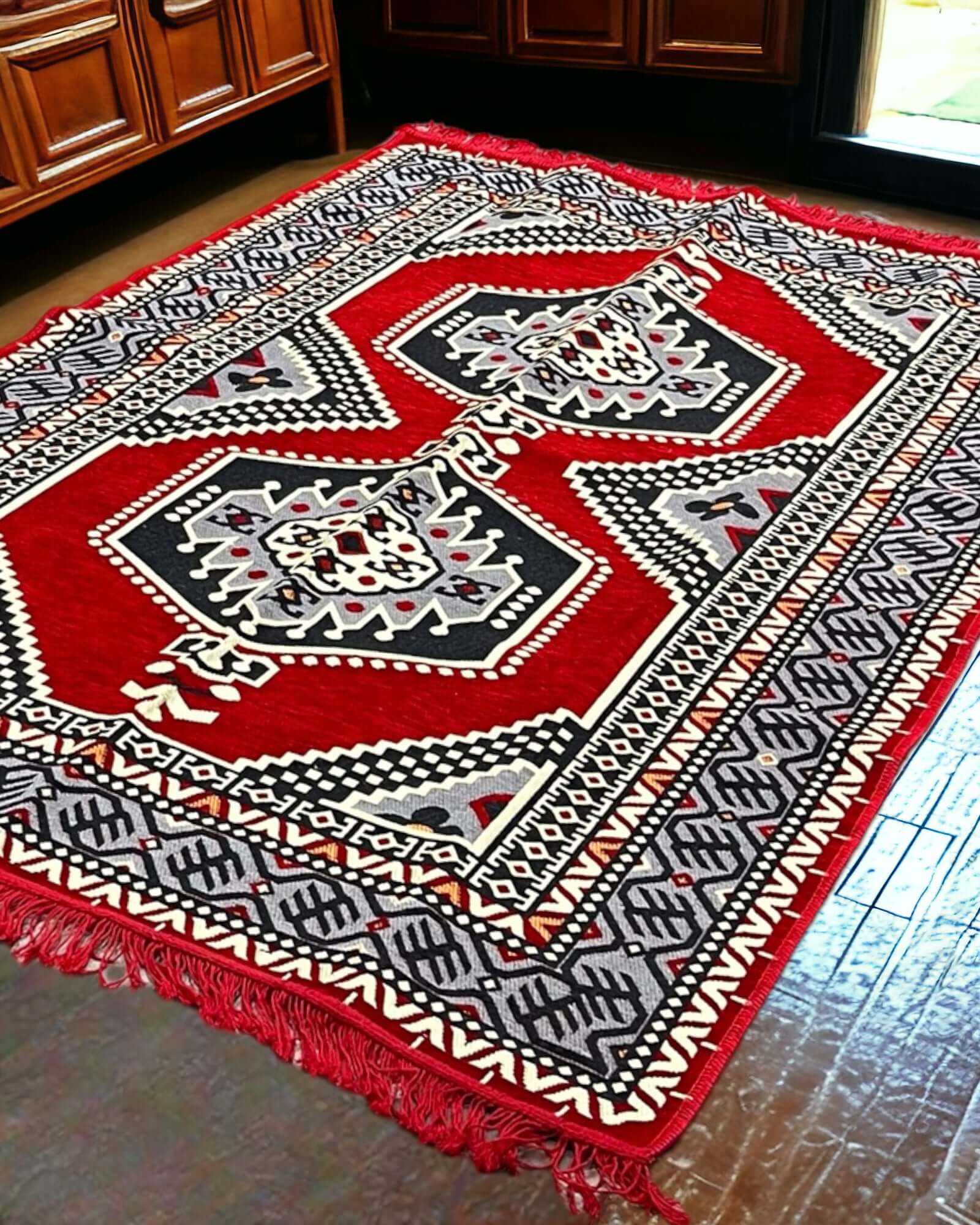 Turkish Kilim Rug (Red Palace)-the perfect match for your divan set and floor cushions. Crafted from 100% cotton in Turkey, this rug seamlessly complements your living space with its captivating geometric pattern and practical design. Not only does the An