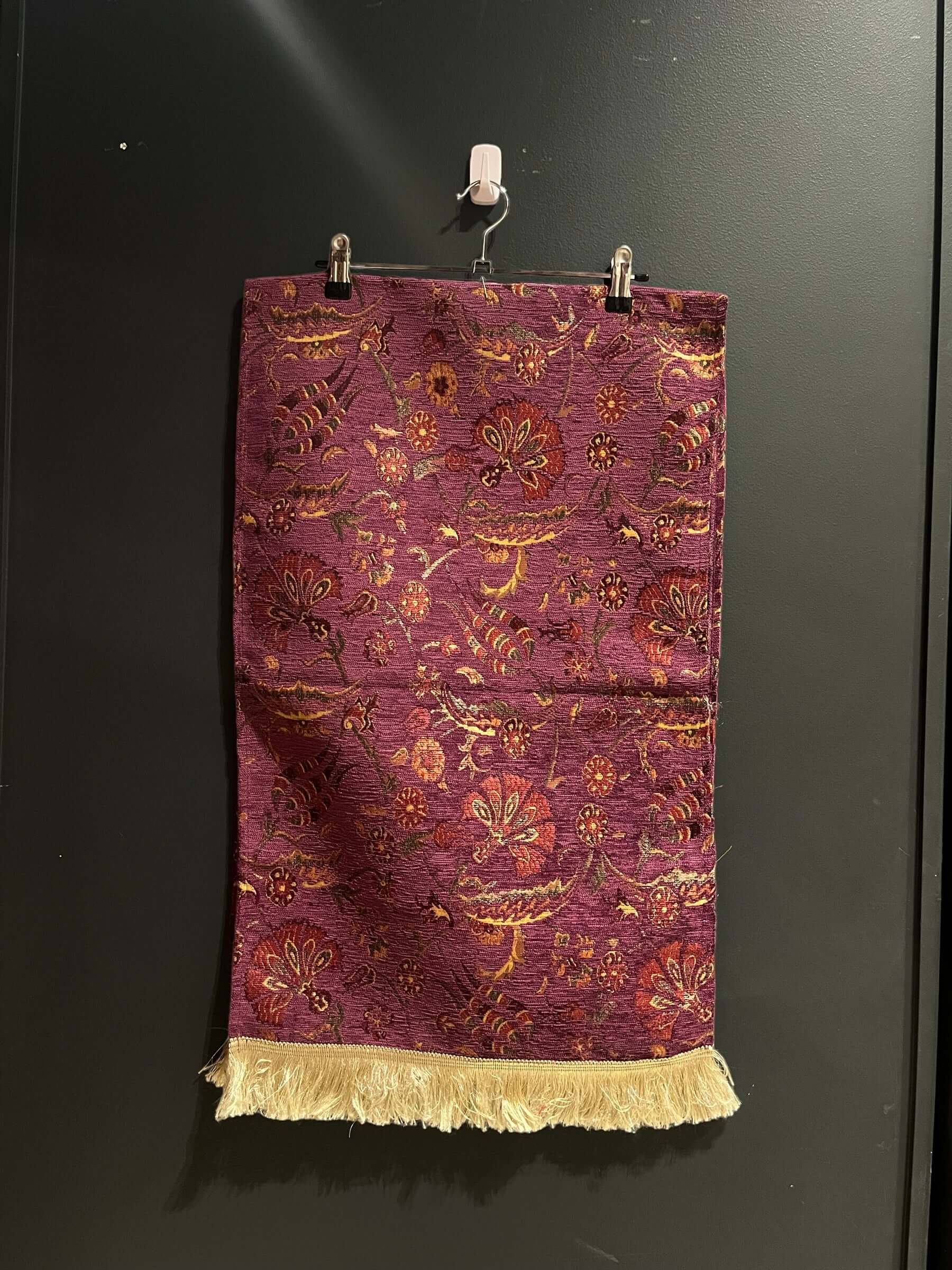 Turkish Table Runner Flowers Puprle-Crafted from acrylic featuring a captivating blend of Tulip and Aztec designs, this table runner effortlessly adds a touch of cultural richness to any setting. Versatile and elegant, it's perfect for both casual and for
