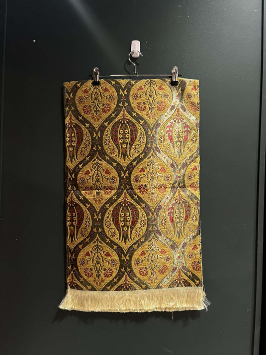 Turkish Table Runner Tulip Cream-Crafted from acrylic featuring a captivating blend of Tulip and Aztec designs, this table runner effortlessly adds a touch of cultural richness to any setting. Versatile and elegant, it's perfect for both casual and formal