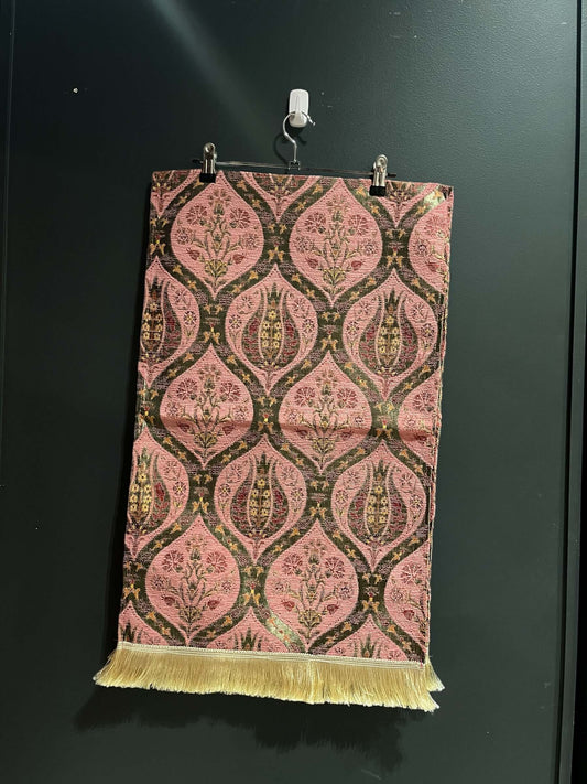 Turkish Table Runner Tulip Pink-Crafted from acrylic featuring a captivating blend of Tulip and Aztec designs, this table runner effortlessly adds a touch of cultural richness to any setting. Versatile and elegant, it's perfect for both casual and formal
