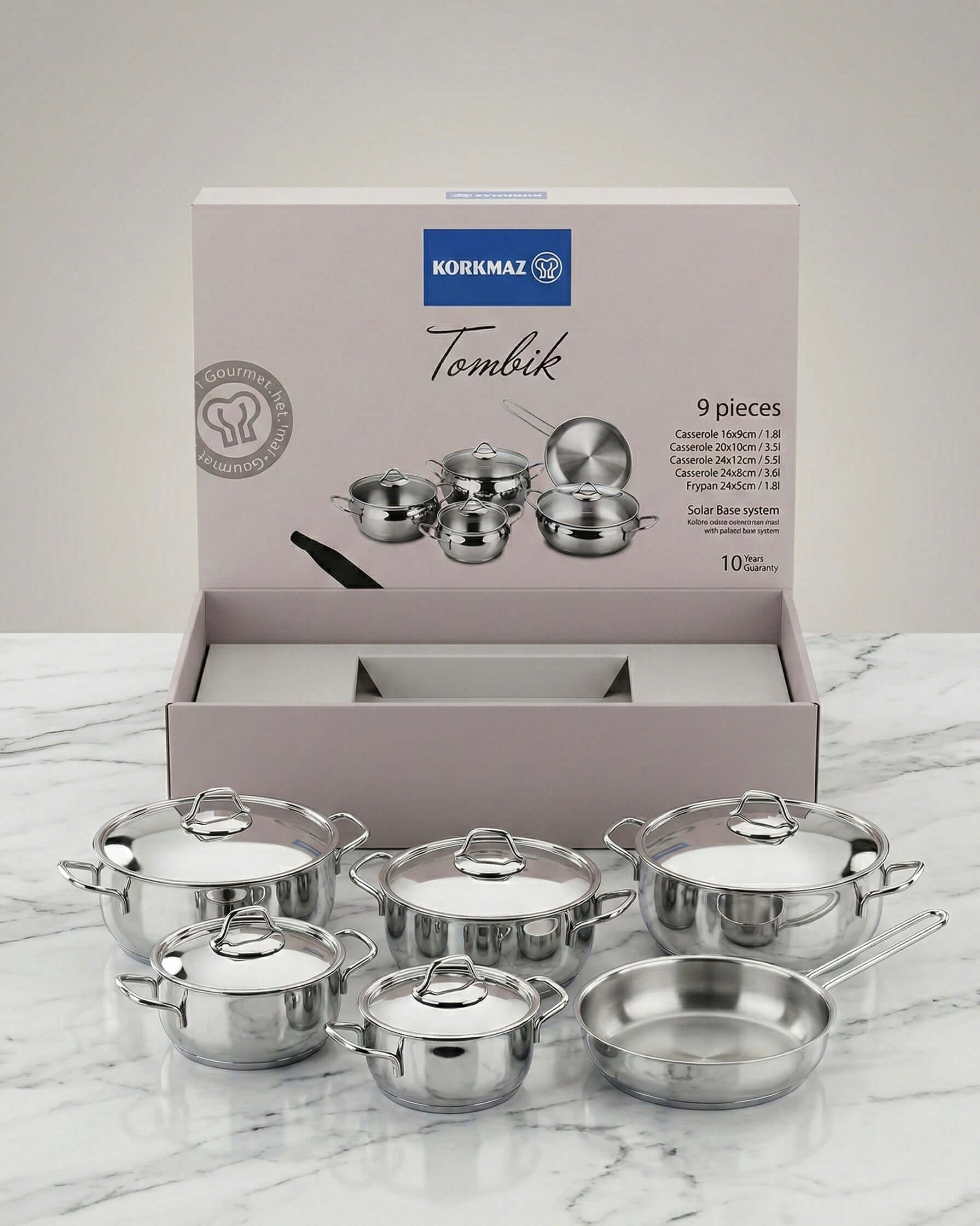 Stainless Steel Cookware Set 9 Piece – Korkmaz Tombik A1800 with pots and lids displayed.