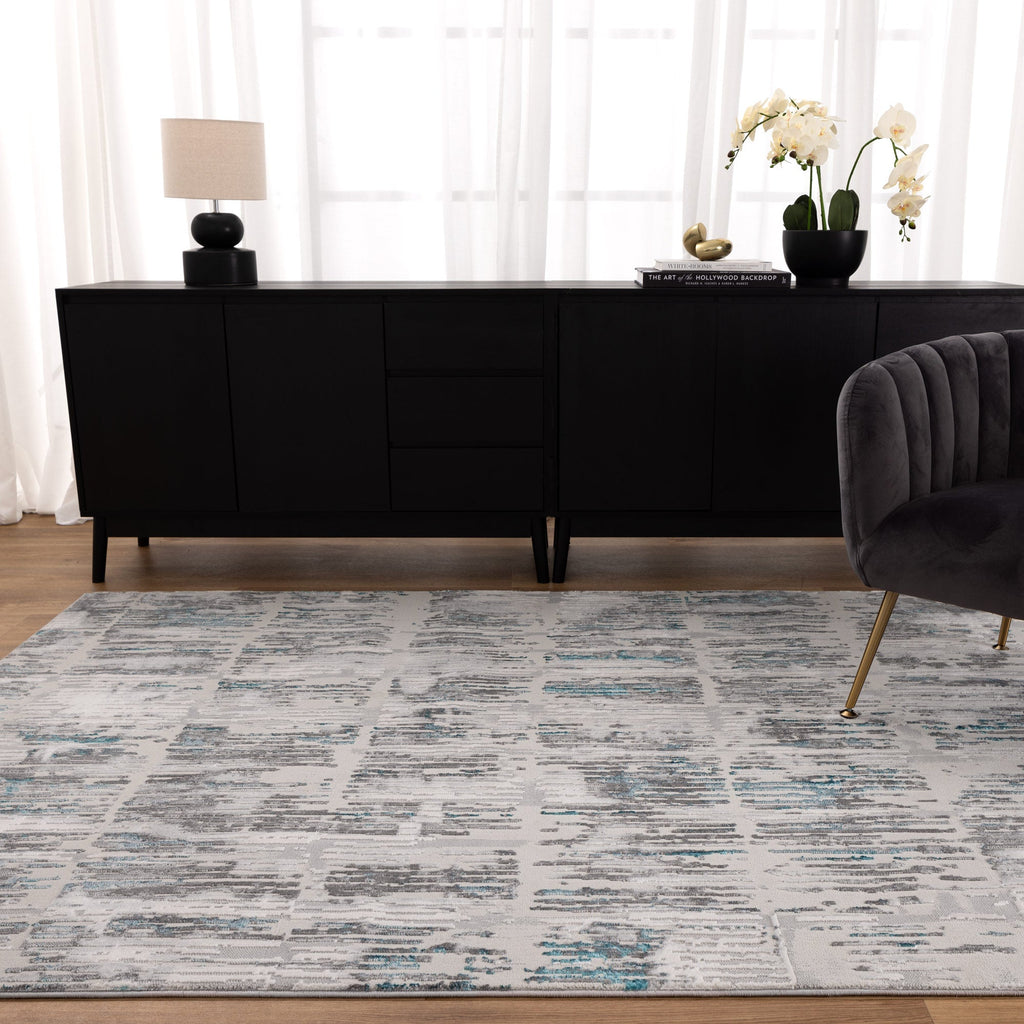 Vestige V002 Abstract Grey Blue Rug styled with furniture
