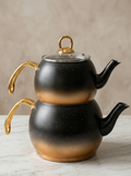 Vicalina Stainless Steel Turkish Tea Kettle Set stacked with gold handles and lids, designed for brewing Turkish tea.