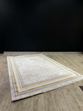 Classic Medallion Turkish Rug showcasing textured luxe in soft neutral tones with gold accents on a wooden floor.