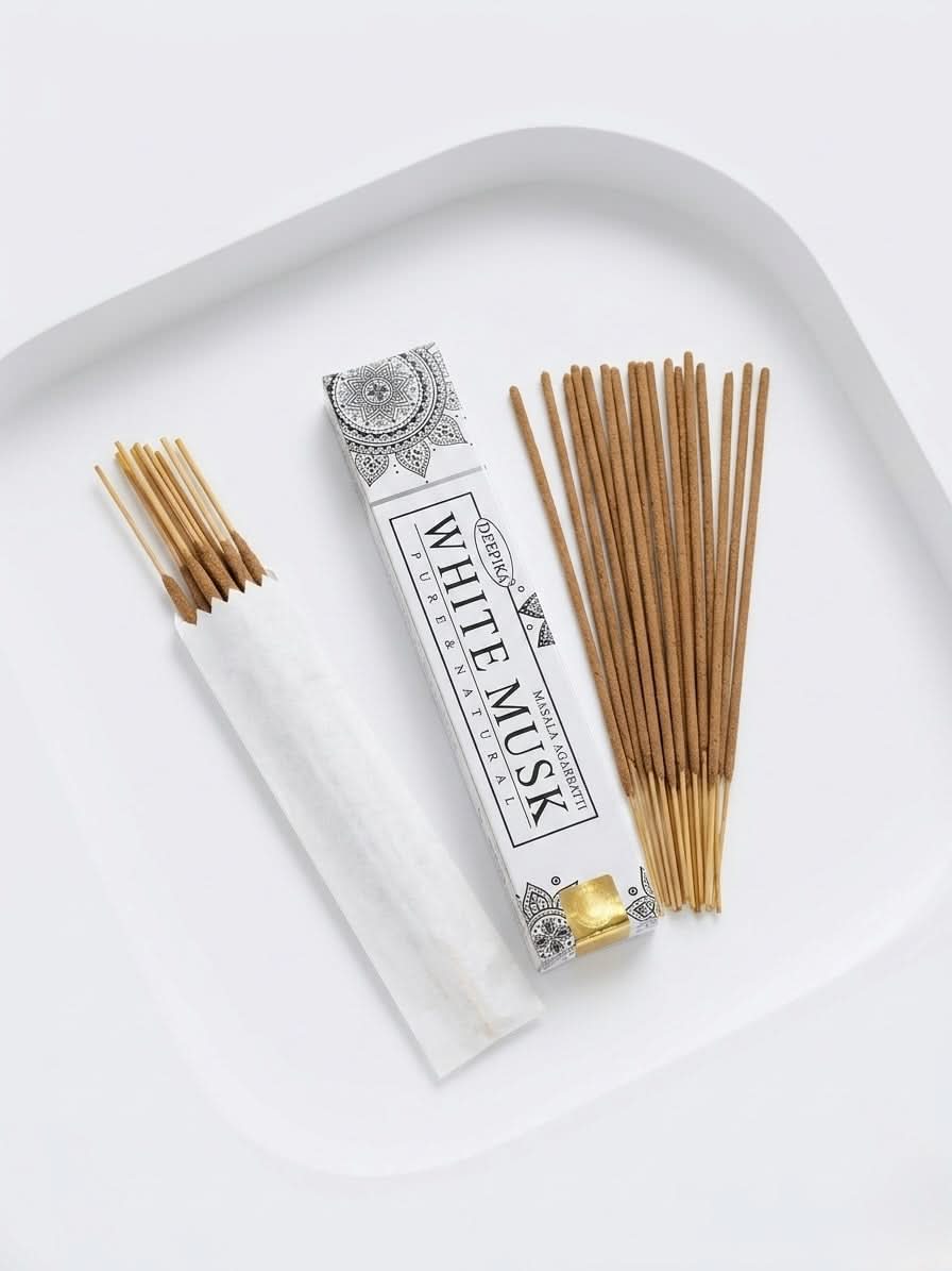 White Musk Incense Sticks package with incense sticks on white dish, offering a soothing atmosphere.