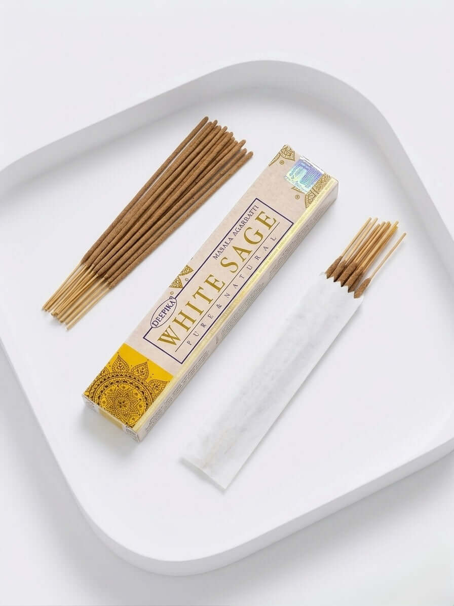 White Sage Incense Sticks displayed on a tray with packaging and incense sticks, ideal for purifying spaces.