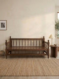 Wood Sedir Bench in a stylish room with natural decor and warm lighting.
