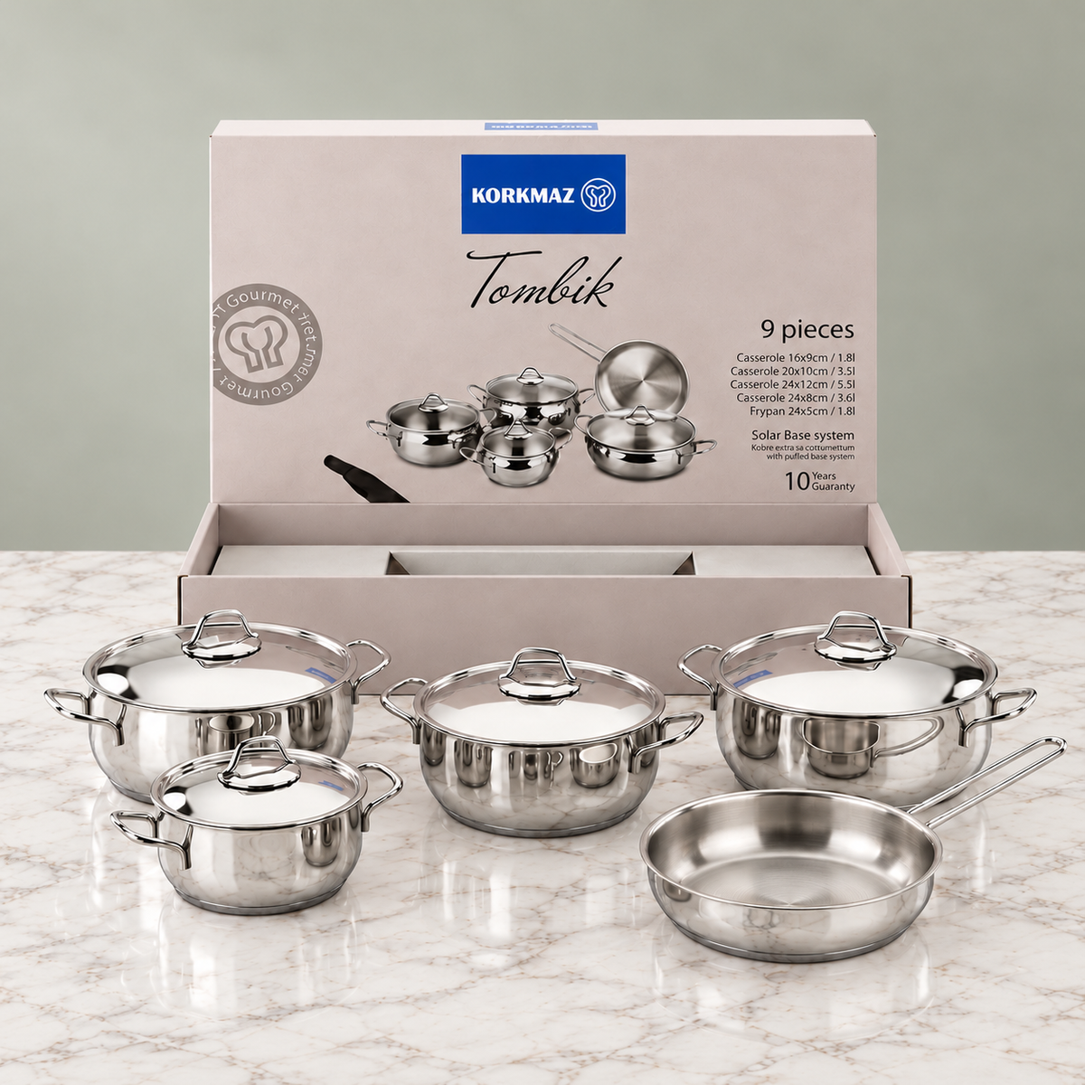 Korkmaz Tombik cookware set with packaging: four lidded pots and one frying pan.