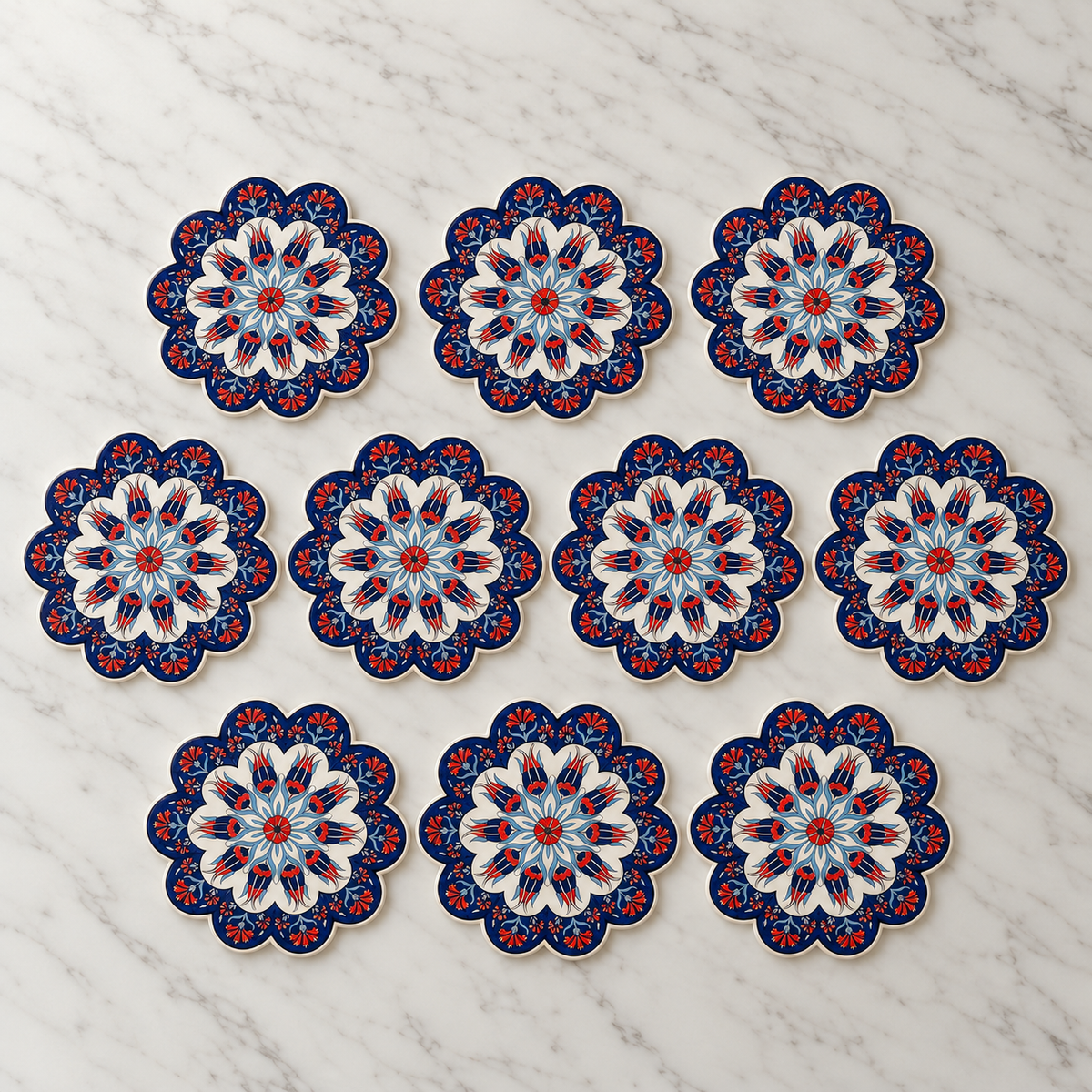 Ten matching Navy Turkish ceramic trivets arranged on pale marble