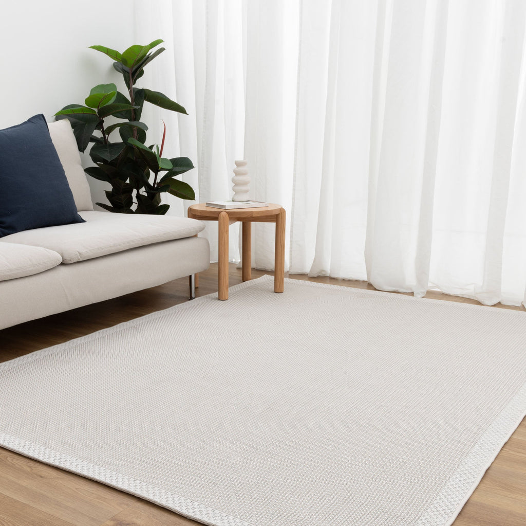 Coastal Living Checkers Border Cream Outdoor Rug - 2CRE — room or full rug view