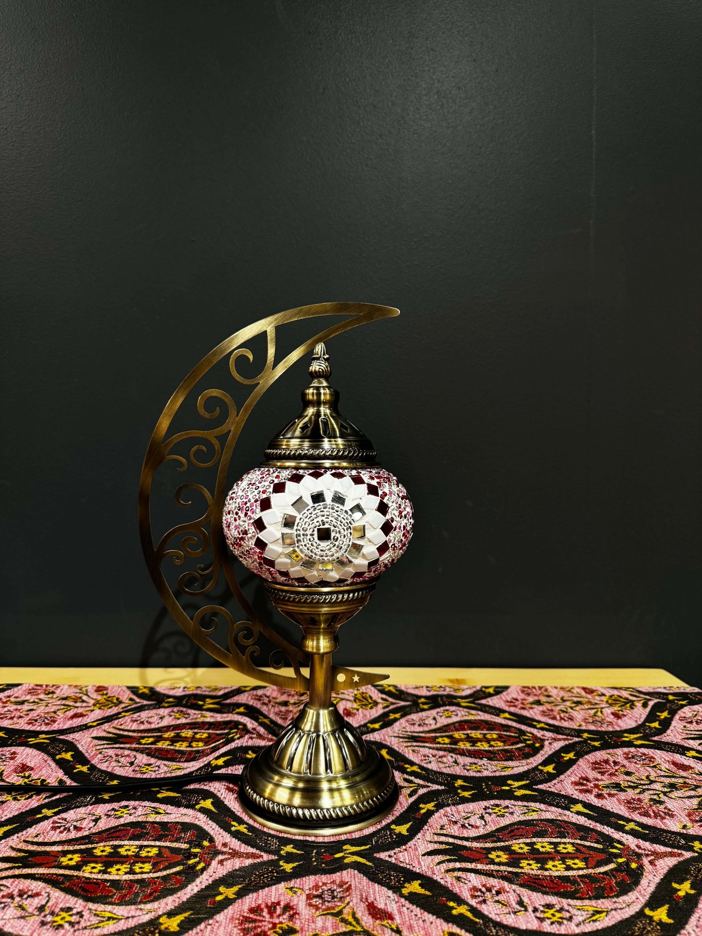 Blush Radiance Turkish Mosaic Lamp with crescent moon stand and intricate floral mosaic design on a decorative table.