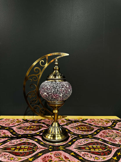 Rose Radiance Turkish mosaic table lamp with crescent moon stand, featuring pink and purple crackled glass on decorative table.