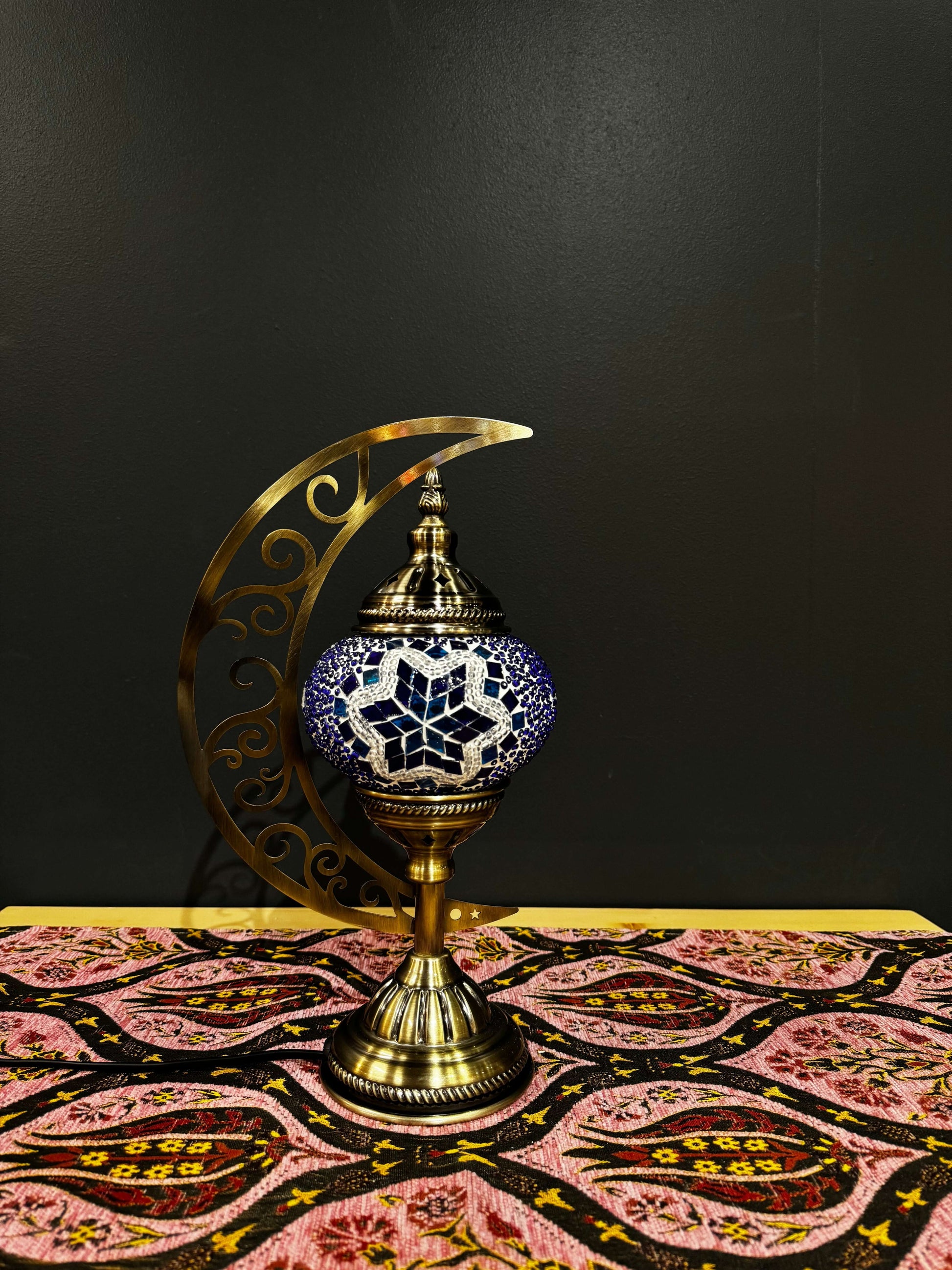 Starry Night Turkish Mosaic Lamp - Crescent Moon DesignShop the Starry Night Turkish Mosaic Lamp! Features a star-shaped blue, turquoise, and gold mosaic design with a crescent moon stand. Includes LED bulb. Perfect for decor or gifting.