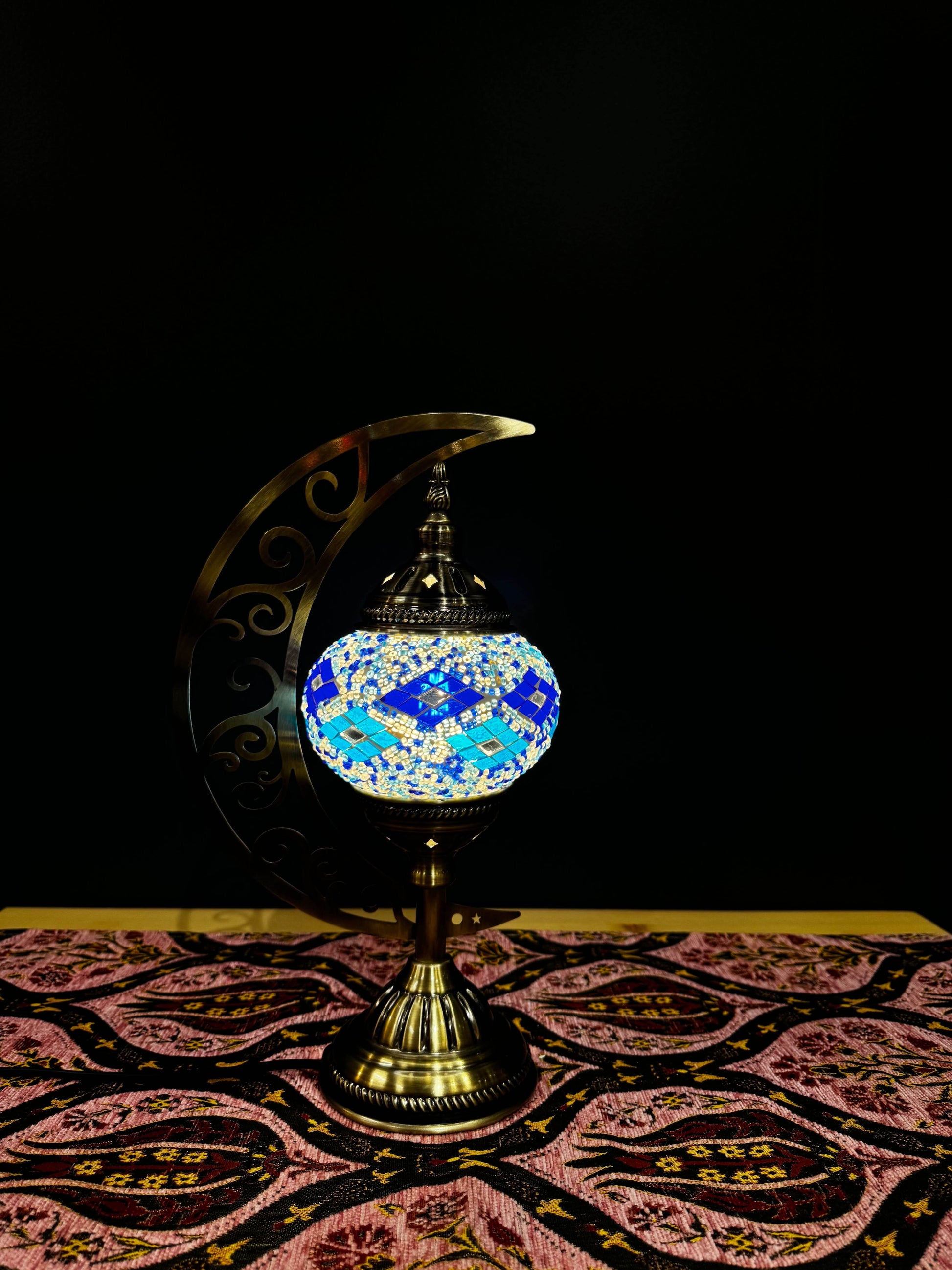 Ocean Breeze Turkish Mosaic Lamp - Crescent Moon DesignOcean Breeze Turkish Mosaic Lamp! Features calming blue, turquoise, and white mosaics with a crescent moon design. Includes LED bulb. Perfect for decor or gifting.