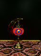 Crimson Star Turkish Mosaic Lamp with crescent moon stand, featuring vibrant red and blue mosaic patterns on a table.