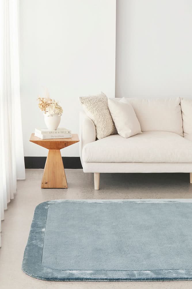 Orlo Blue Border Wool Rug - styled room