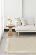 Orlo Husk Border Wool Rug - styled room