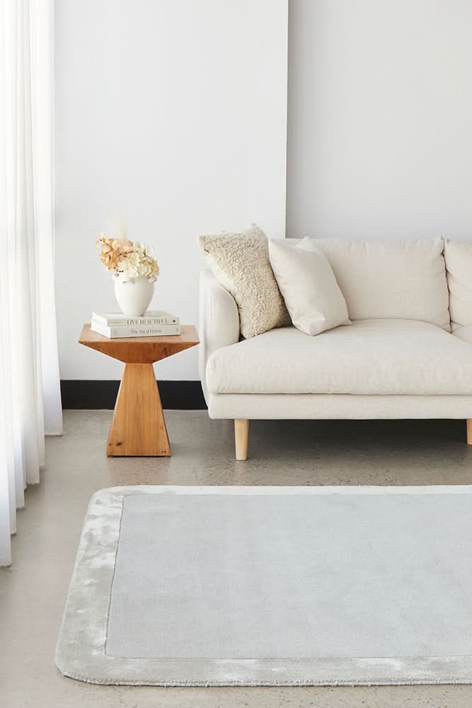 Orlo Silver Border Wool Rug - styled room
