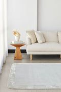 Orlo Silver Border Wool Rug - styled room