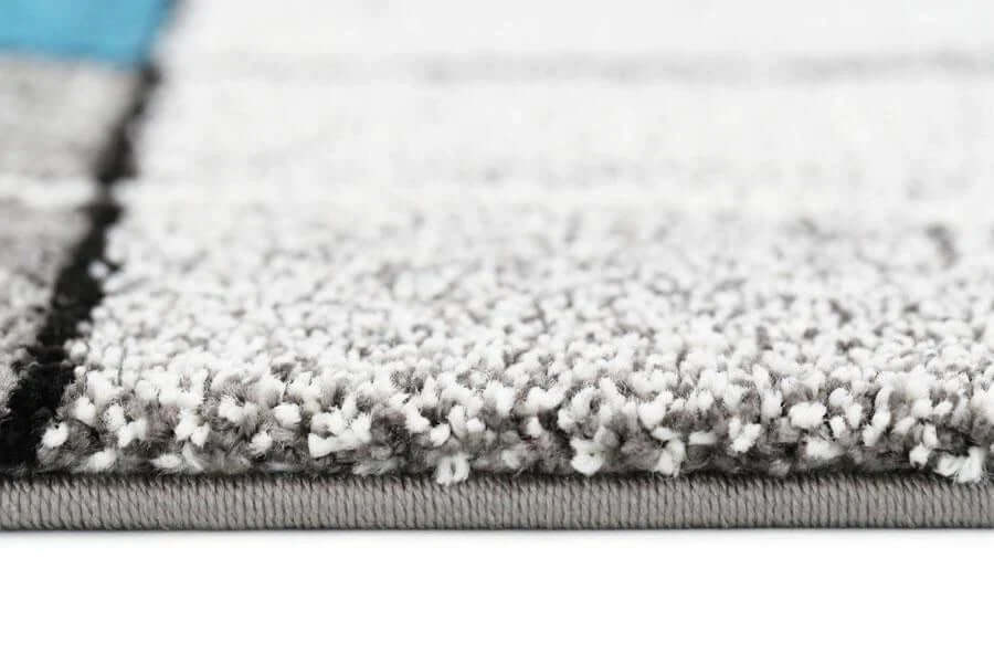 Passion 03 grey green rug styled in a modern interior