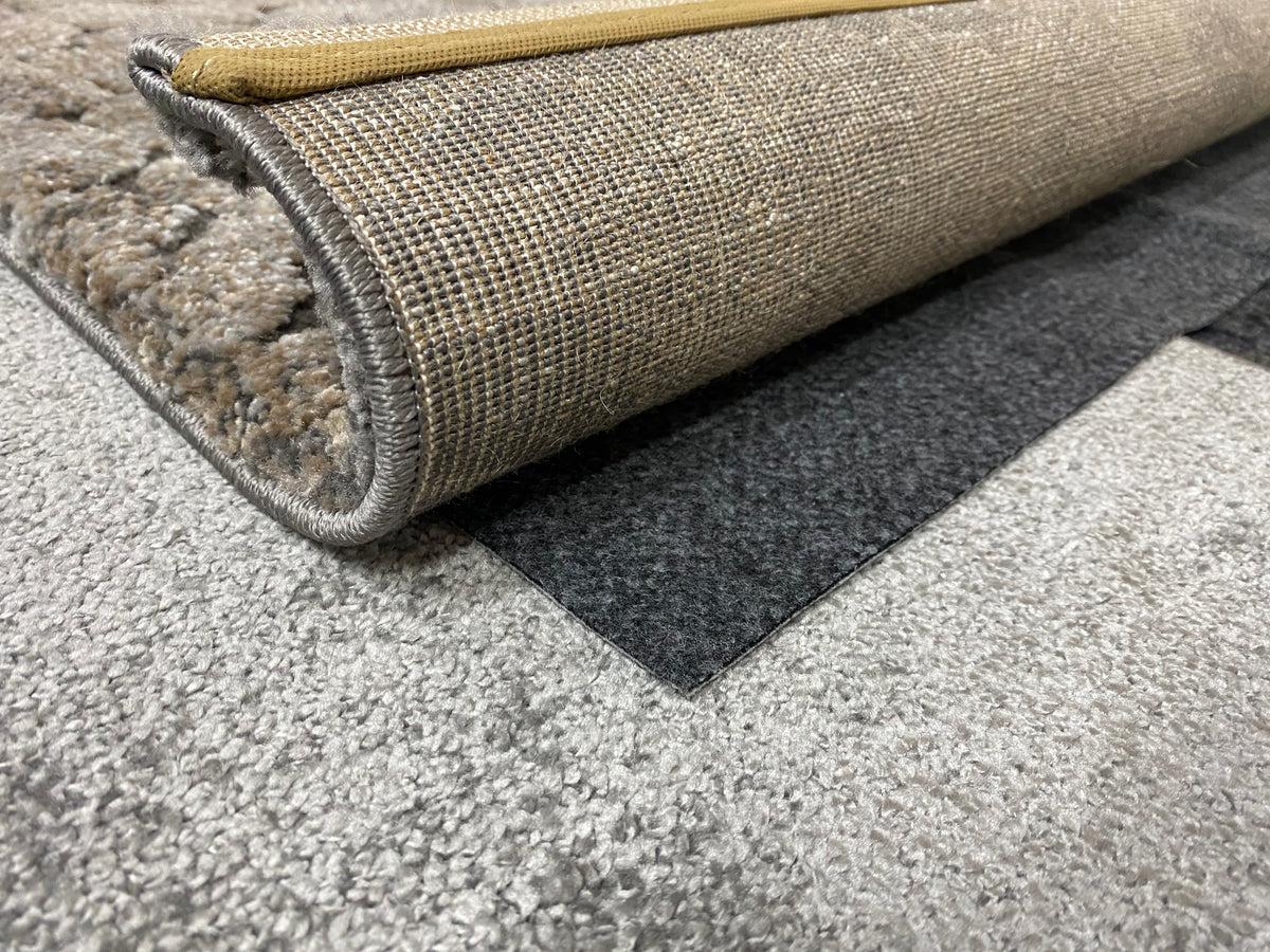 Rug Stop underlay beneath a rug on carpet; rug shown for demonstration