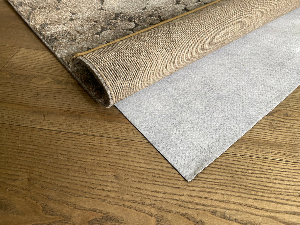 Rug Stop underlay beneath a rug on a hard floor; rug shown for demonstration