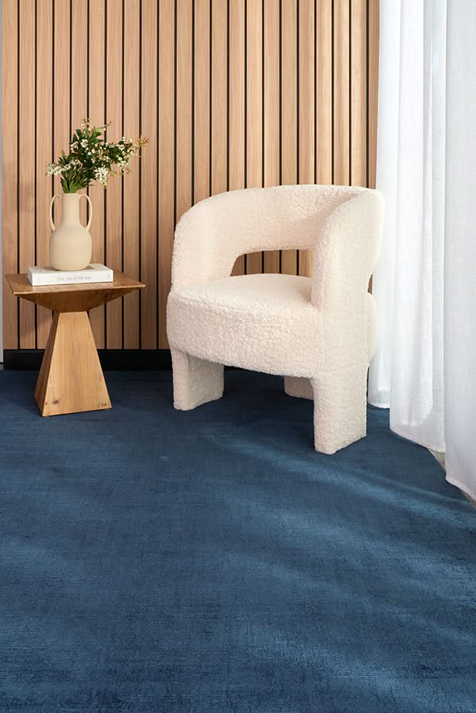 Vela Denim Viscose Rug - styled room