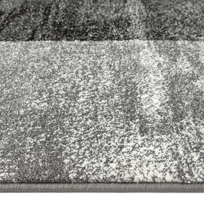 Geo Elegance 444 Grey-This thick and dense, heavy-duty collection has a durable construction and is power loomed in Turkey from heat-set polypropylene with shed-resistant and anti-static properties. Its modern, abstract designs are woven into stain-hiding