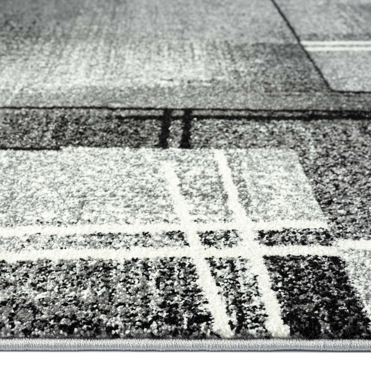 Geo Elegance 754 Grey-This thick and dense, heavy-duty collection has a durable construction and is power loomed in Turkey from heat-set polypropylene with shed-resistant and anti-static properties. Its modern, abstract designs are woven into stain-hiding