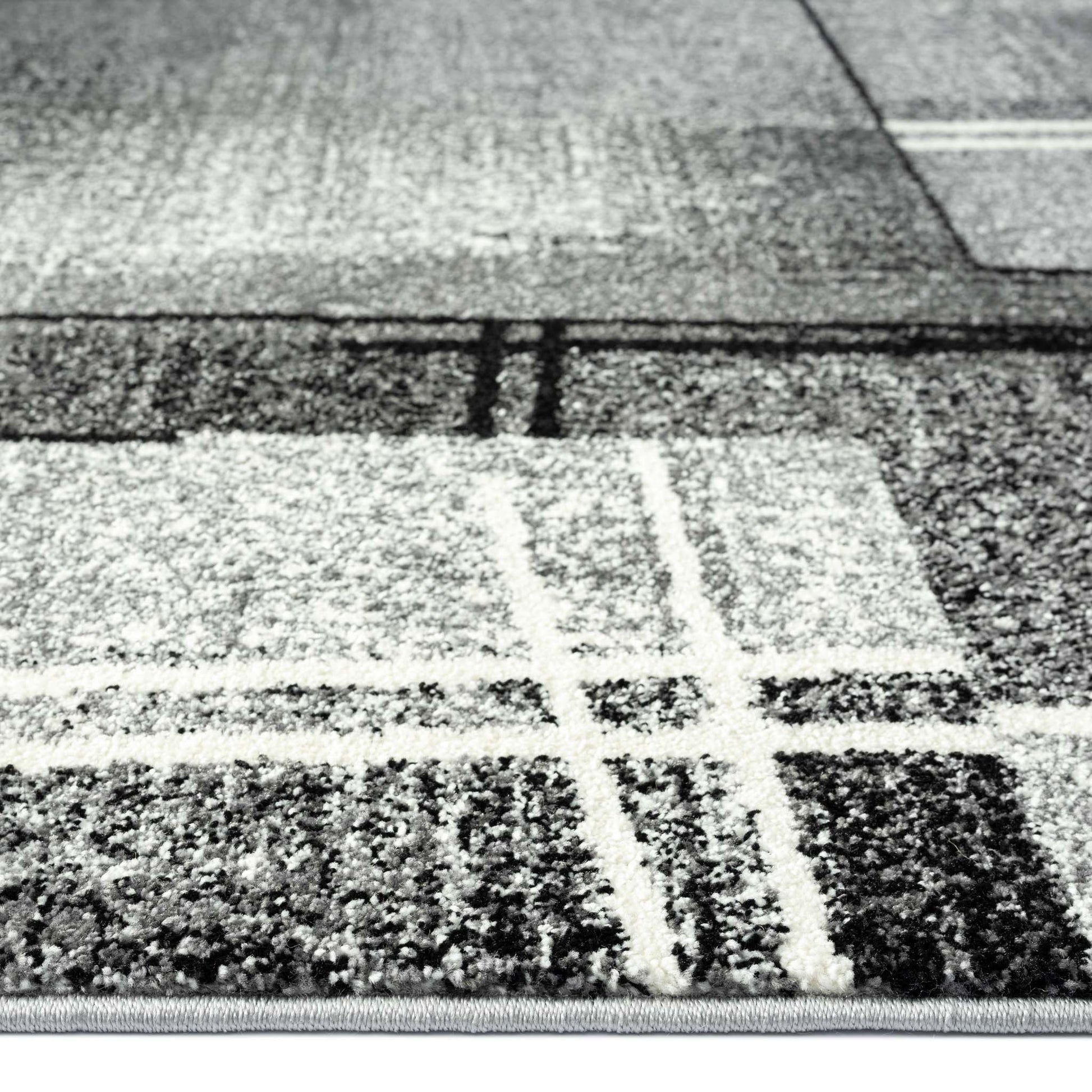Geo Elegance 754 Grey-This thick and dense, heavy-duty collection has a durable construction and is power loomed in Turkey from heat-set polypropylene with shed-resistant and anti-static properties. Its modern, abstract designs are woven into stain-hiding