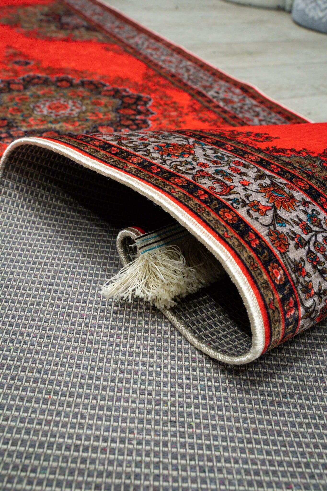 Turkish Hallway Runner Rug rolled with intricate red and black patterns showing soft texture and durability.