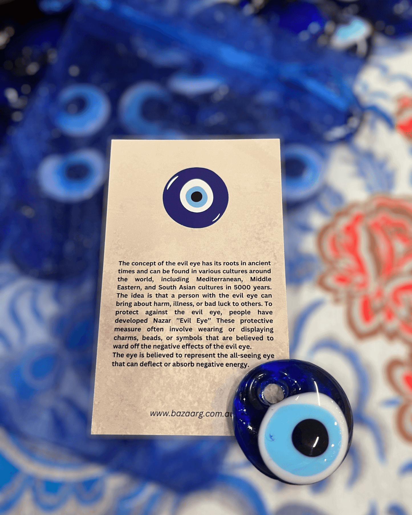 Bring a symbol of protection into your home with this Evil Eye Bead (Nazar). This beautiful, handcrafted bead is an ancient charm with a timeless design that has been used for centuries to ward off negative energy. The Evil Eye Bead is a perfect addition